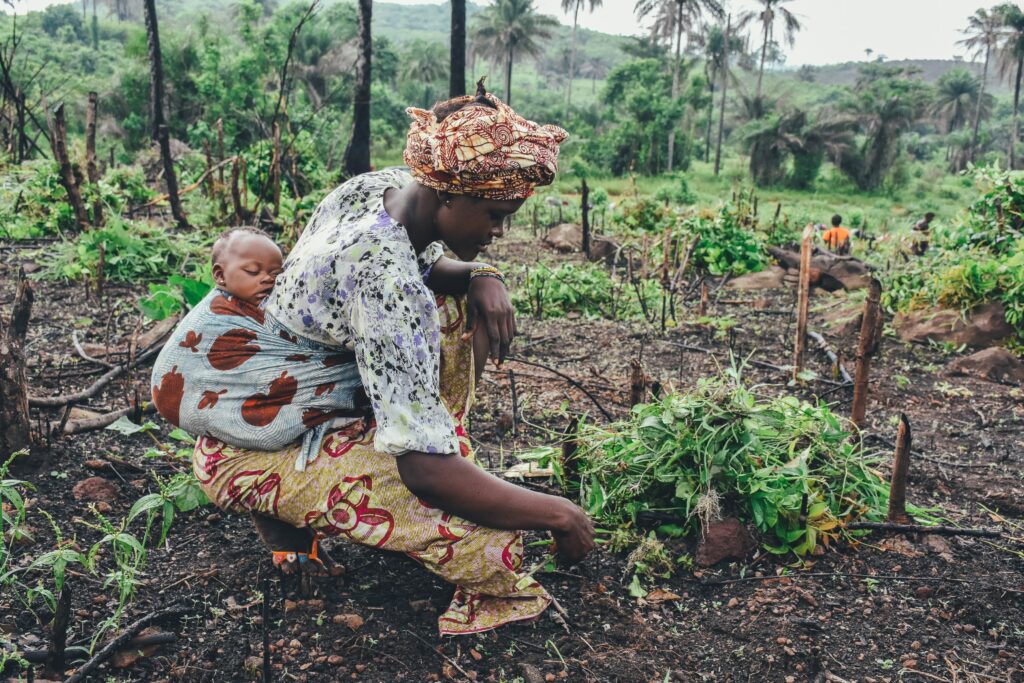 Woman with child farm Africa