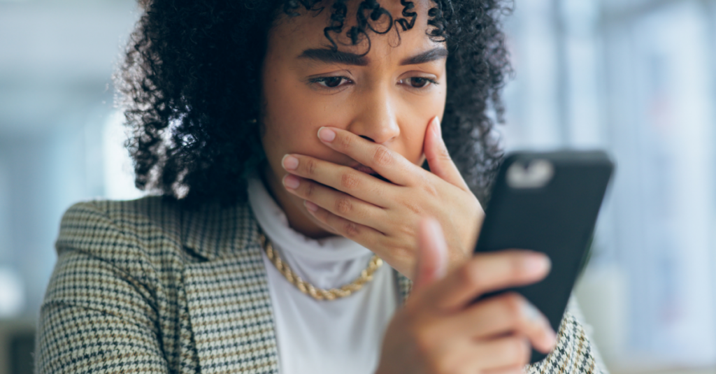 surprised woman looking at phone