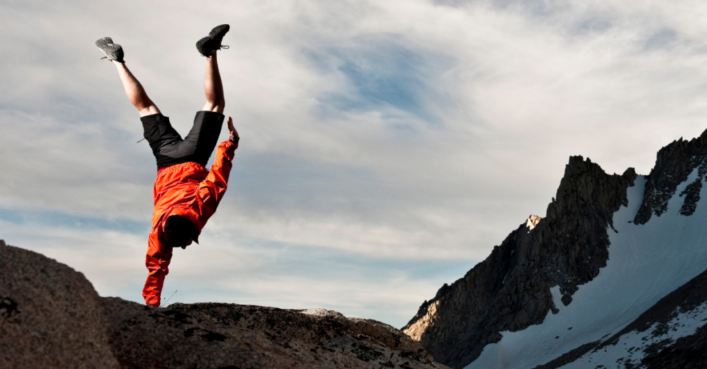 man balancing on one hand