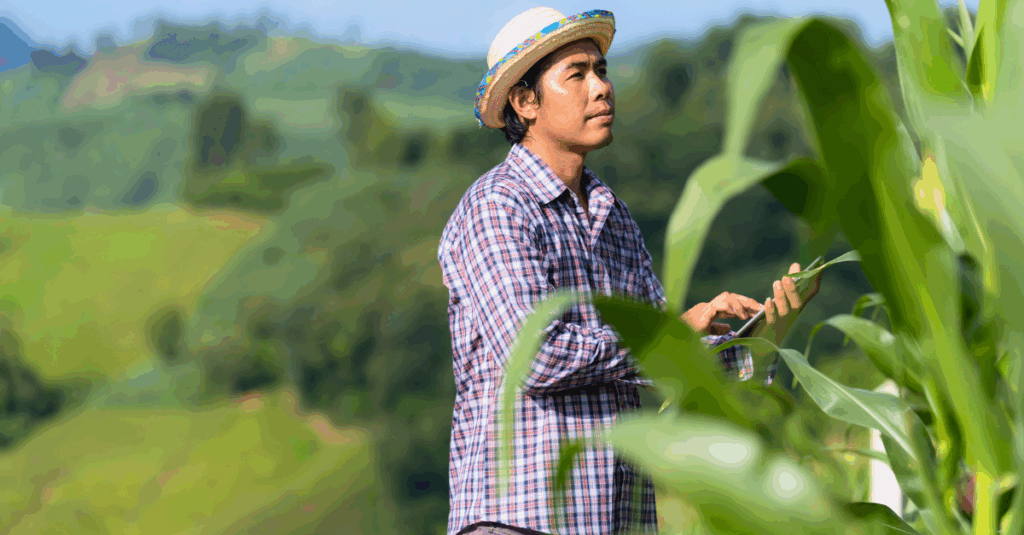 man in crops with ipad