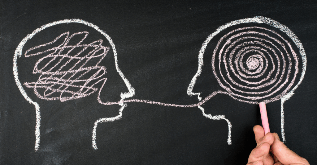 chalk drawing of two heads with messy string